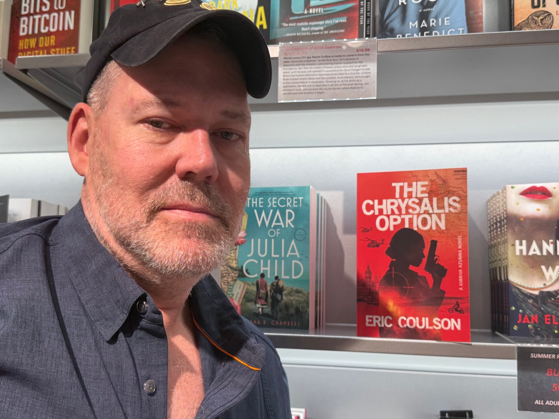Eric Coulson beside The Chrysalis Option on a bookstore shelf